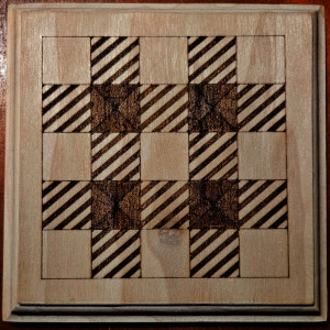 Wood board with a 5 by 5 grid and plaid theme